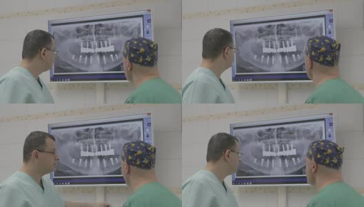 特写的两名医生与x光指纹高清在线视频素材下载