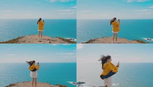 WS MS MONTAGE ZI PAN女子在悬崖顶上拍照/葡萄牙高清在线视频素材下载
