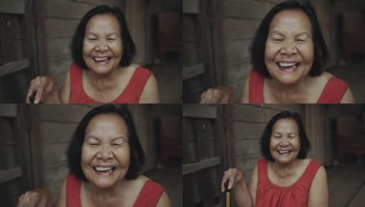 慢动作的泰国老妇人圆领无袖领在老木屋里笑高清在线视频素材下载