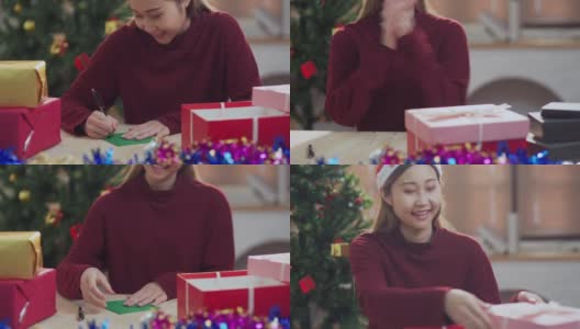 年轻的亚洲少女打开圣诞礼盒高清在线视频素材下载