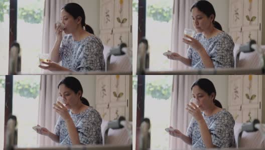 成熟的亚洲女人在卧室里吃药高清在线视频素材下载
