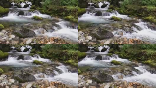 湍急的山河中，水流过石头。自然景观,瀑布。高清在线视频素材下载