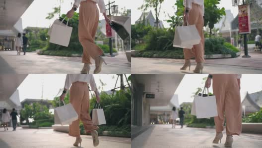 女人走路的特写腿购物袋高清在线视频素材下载