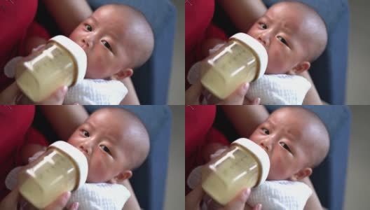 婴儿用奶瓶喝牛奶高清在线视频素材下载