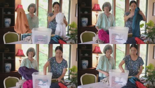 亚洲家庭用捐赠箱准备衣物高清在线视频素材下载