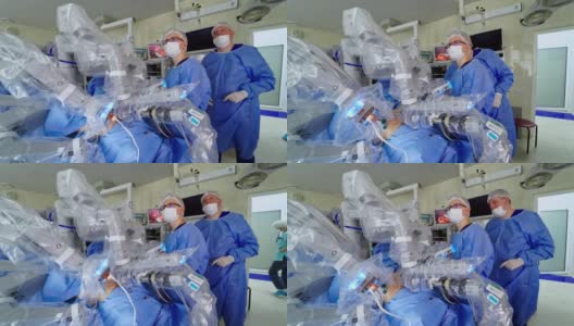 外科医生在移除手术期间。医疗机器人达文西手术技术机器高清在线视频素材下载