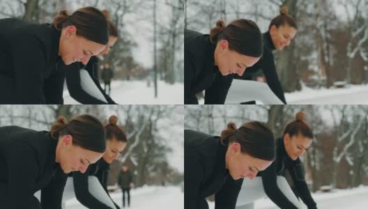 两个女人在雪地里锻炼高清在线视频素材下载
