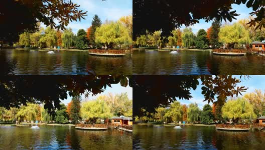 带有人工池塘的中心城市公园是热门的休闲点。秋天五颜六色的树木和自然环境给居民和游客带来了正能量高清在线视频素材下载