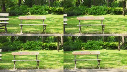 夏日阳光明媚的绿色公园里，空荡荡的旧板凳和复印空间高清在线视频素材下载