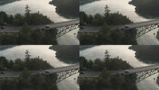 运输空中建立公路旅行与黑色SUV卡车驾驶越过高桥到海洋背景高清在线视频素材下载