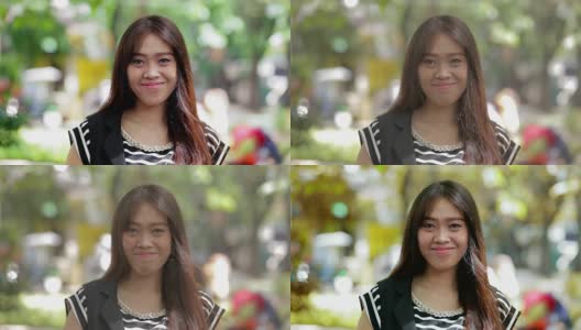 美丽的东南亚女人在镜头前微笑的肖像公园与三种色调高清在线视频素材下载