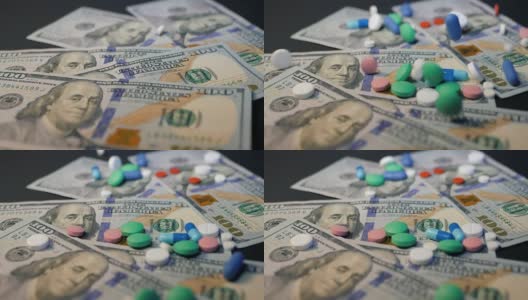 药丸落在钞票上，昂贵的药品，制药生意。药店的主题。多色药片和胶囊的钞票。慢动作高清在线视频素材下载