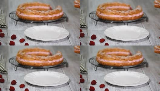 自制泡芙糕点巴黎布雷斯特与覆盆子。法国甜点。高清在线视频素材下载