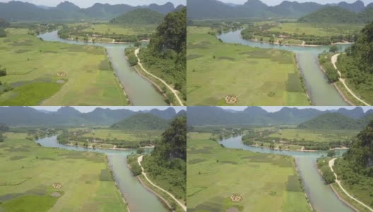 宁静的河流沿着山谷流淌，田野鸟瞰图高清在线视频素材下载