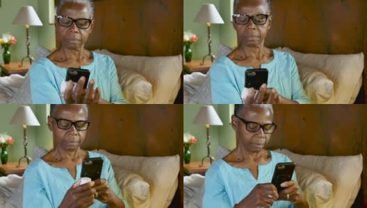 一名黑人妇女用她的手机扫描一个药瓶，并重新填写她的处方高清在线视频素材下载