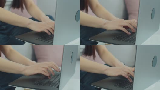 女性用手在笔记本电脑上打字，坐在家里用笔记本键盘上网。女孩在家工作在家学习电脑软件应用技术概念，近看侧面。高清在线视频素材下载
