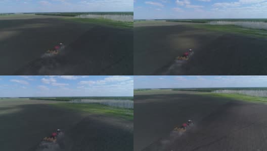 一台大拖拉机在田里工作，播种和犁地在同一时间高清在线视频素材下载