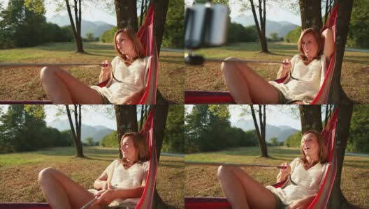 女子在吊床上用手机自拍高清在线视频素材下载