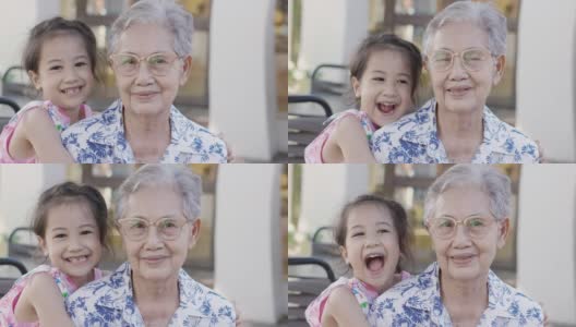 近4K户外的亚洲奶奶和孙女一起笑着，老女表达了对养老家庭的情感积极和幸福。高清在线视频素材下载