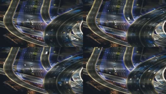 T/L无人机视角的天桥和城市交通在夜间高清在线视频素材下载