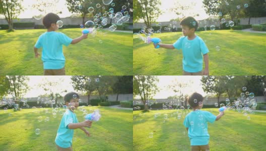 亚洲小孩在公园玩泡泡。幸福和夏日的概念高清在线视频素材下载