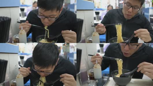 香港，一名男子在当地餐馆吃鸡蛋面。高清在线视频素材下载