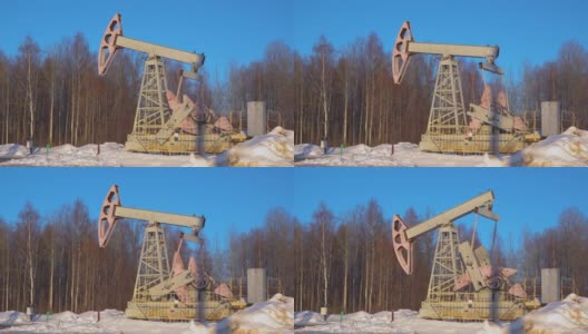 冬季森林背景上的石油摇椅高清在线视频素材下载