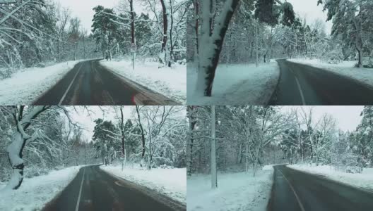 无人机飞过道路穿过冬天的雪林。汽车观点。高清在线视频素材下载