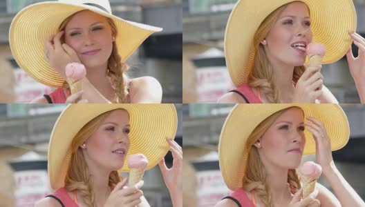 年轻漂亮的女孩戴着一顶大帽子，吃着冰淇淋高清在线视频素材下载