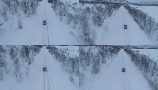 空中特写:汽车在芬兰冬季山谷的冰雪道路上行驶高清在线视频素材下载