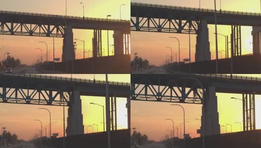 特写:在金色的夕阳下，开车穿过底特律的工业区高清在线视频素材下载