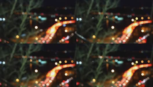 在一个立交桥上，夜间交通堵塞的散焦亮度散焦时间高清在线视频素材下载