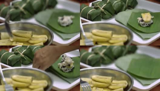 女人用香蕉和糯米做咖喱泥，泰式甜点，烤架高清在线视频素材下载