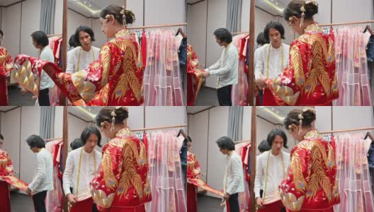 中国婚纱设计师在工作室试穿新娘高清在线视频素材下载
