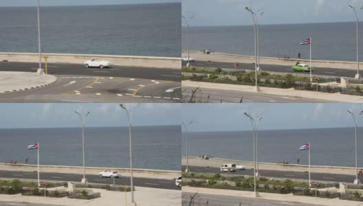 老爷车行驶在哈瓦那主要公路上，经过古巴国旗高清在线视频素材下载