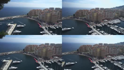 在欧洲摩纳哥蒙特卡洛的海湾，珍贵的公寓和配有豪华游艇的港口高清在线视频素材下载