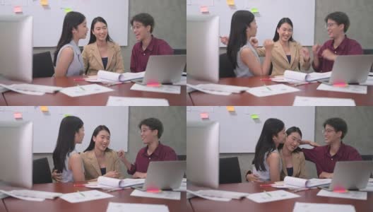 一群亚洲年轻商业女性或办公室女性使用电脑，在现代办公室一起讨论工作的4k视频，快乐和成功的情绪概念高清在线视频素材下载