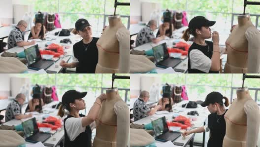 亚洲华人大学时装学生在课堂上研究他们的时装设计高清在线视频素材下载