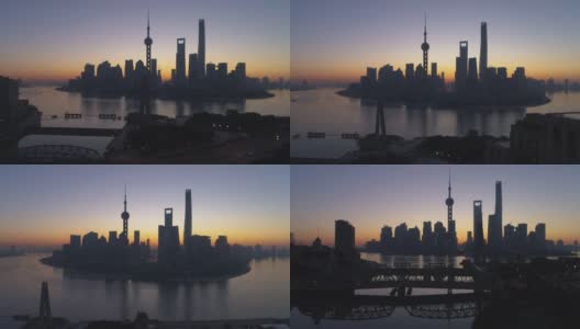 黎明时分的上海全景。陆家嘴金融区和黄浦江。中国鸟瞰图。无人机是横向和向上飞行。远景高清在线视频素材下载