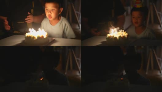 拿着生日蛋糕的亚洲小孩。庆祝和快乐的概念高清在线视频素材下载