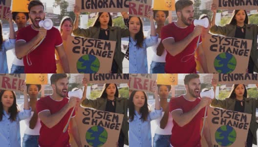 一群示威者在路上，来自不同文化和种族的年轻人为气候变化而战——全球变暖和环境的概念高清在线视频素材下载
