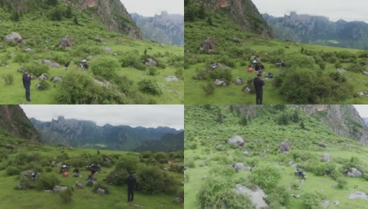 无人机拍摄的山谷、绿色草地和民居，中国甘南州洛克路高清在线视频素材下载
