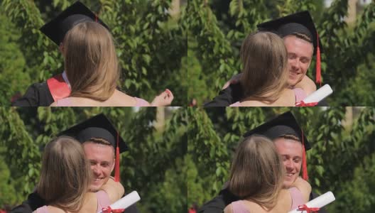 女子祝贺毕业男友并拥抱他，快乐的时刻高清在线视频素材下载