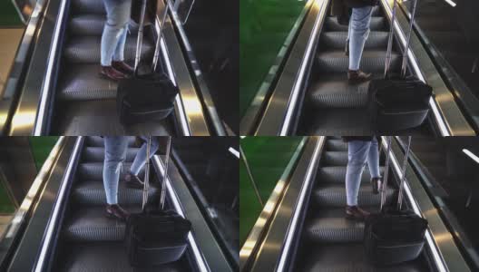 在机场自动扶梯上的女人高清在线视频素材下载