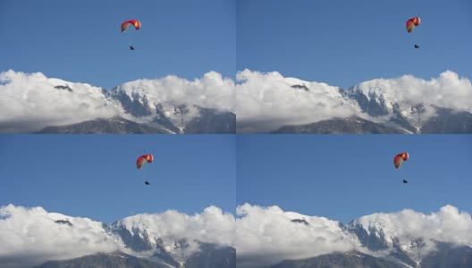 雪山上的滑翔伞享受飞行高清在线视频素材下载