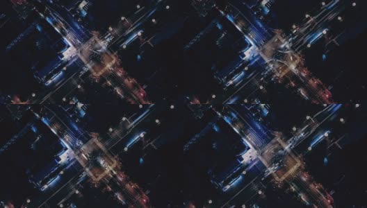 T/L无人机视角下的城市街道十字路口在夜间高清在线视频素材下载