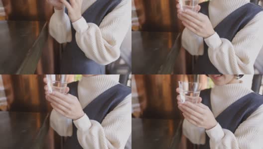 年轻女子喝日本“Saki”米酒在“Tachinomi”站酒吧- 2的第一部分高清在线视频素材下载