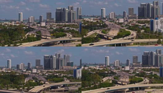 鸟瞰图迈阿密设计区和朱莉娅塔特尔堤道上方的大高架交叉州际95和州际195在北迈阿密，佛罗里达州。Drone-made b - roll的画面。高清在线视频素材下载