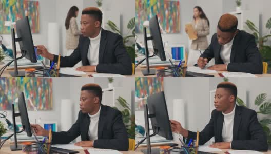 英俊的深色皮肤的男人，公司职员花上午在电脑前，指着屏幕，计数，思考，检查图表的正确性，完成数据高清在线视频素材下载