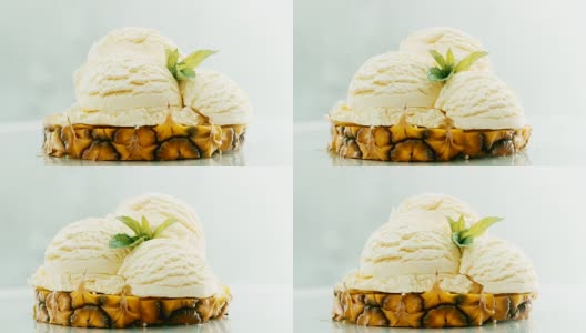 将菠萝和冰淇淋切成薄片，在上面点缀新鲜的薄荷高清在线视频素材下载